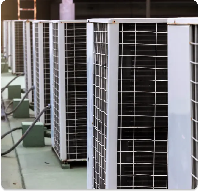 Row of commercial HVAC units installed on a rooftop.