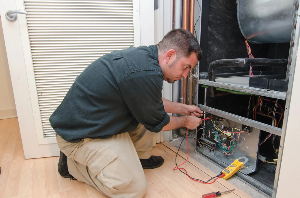 Technician servicing a heating system.