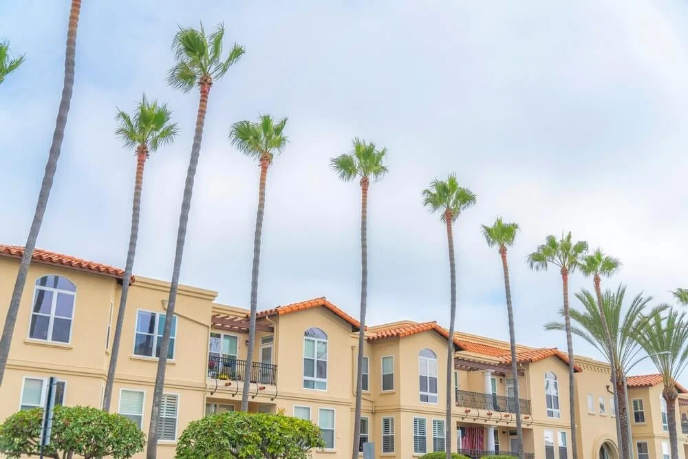 Residential complex building with palm trees at the front at Carlsbad, San Diego, California.