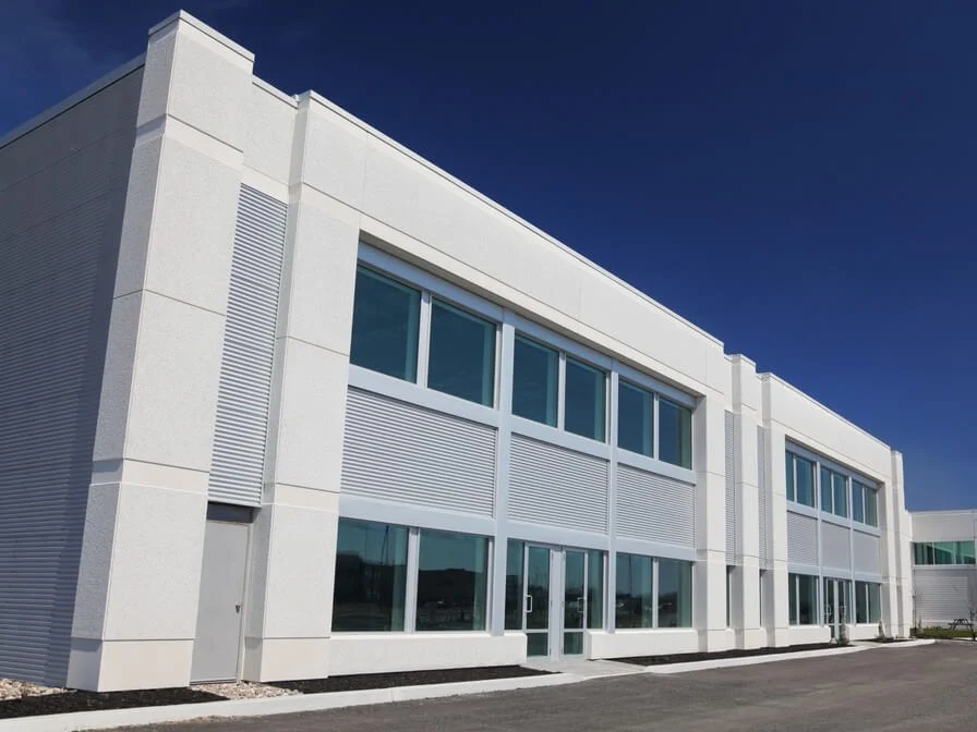Modern light-commercial building with large windows, suitable for HVAC services including heating, cooling, and ventilation system installation.