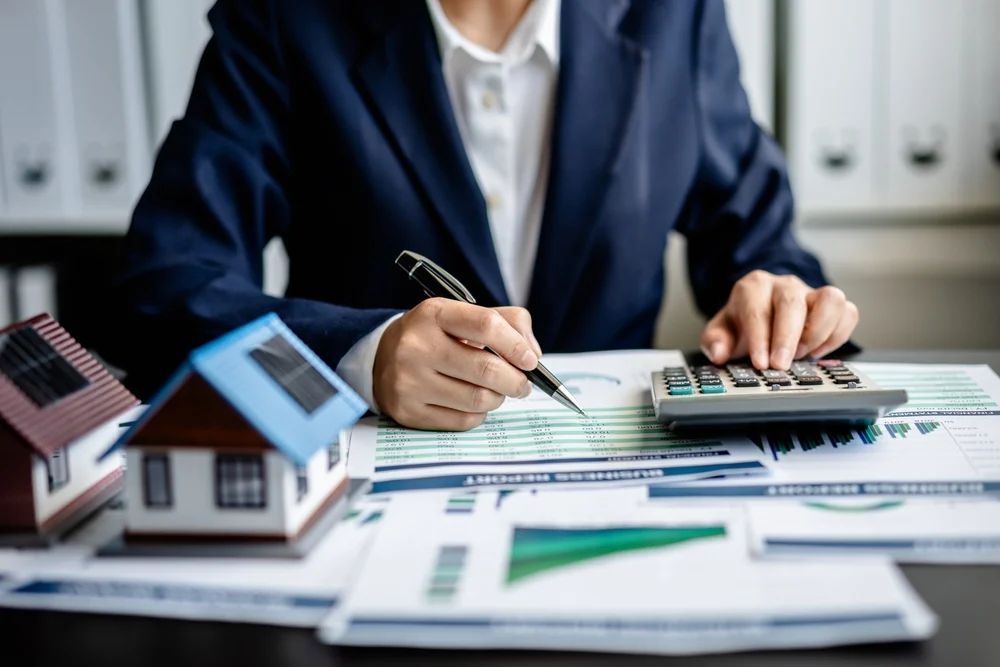 Property manager reviewing HVAC service costs and budgeting for multi-family building upgrades.