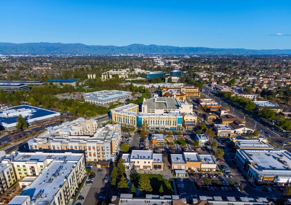 Aerial view of commercial and multi-family buildings in Cupertino, Bay Area, showing diverse HVAC needs across property types.