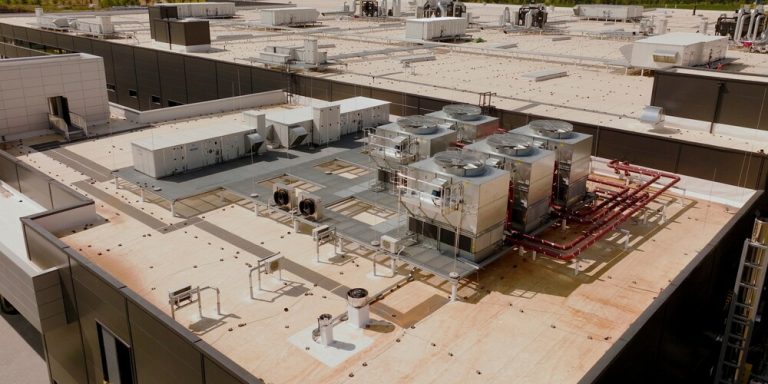Rooftop HVAC systems on a large commercial building in San Diego showing multiple units and system layout