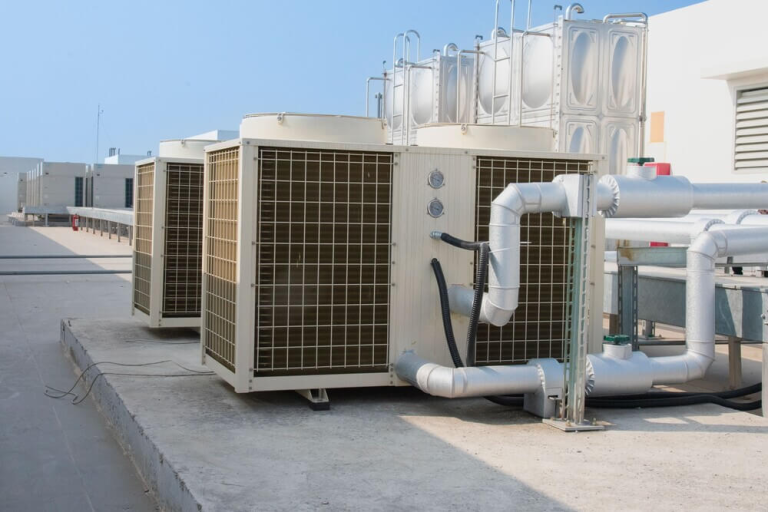 Commercial rooftop HVAC units serving a San Jose office building during peak summer cooling demand.