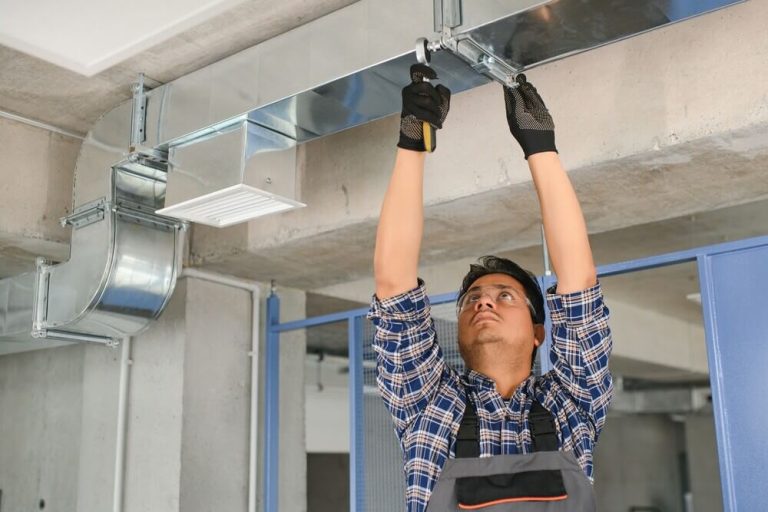 Technician inspecting commercial air ductwork in San Jose.